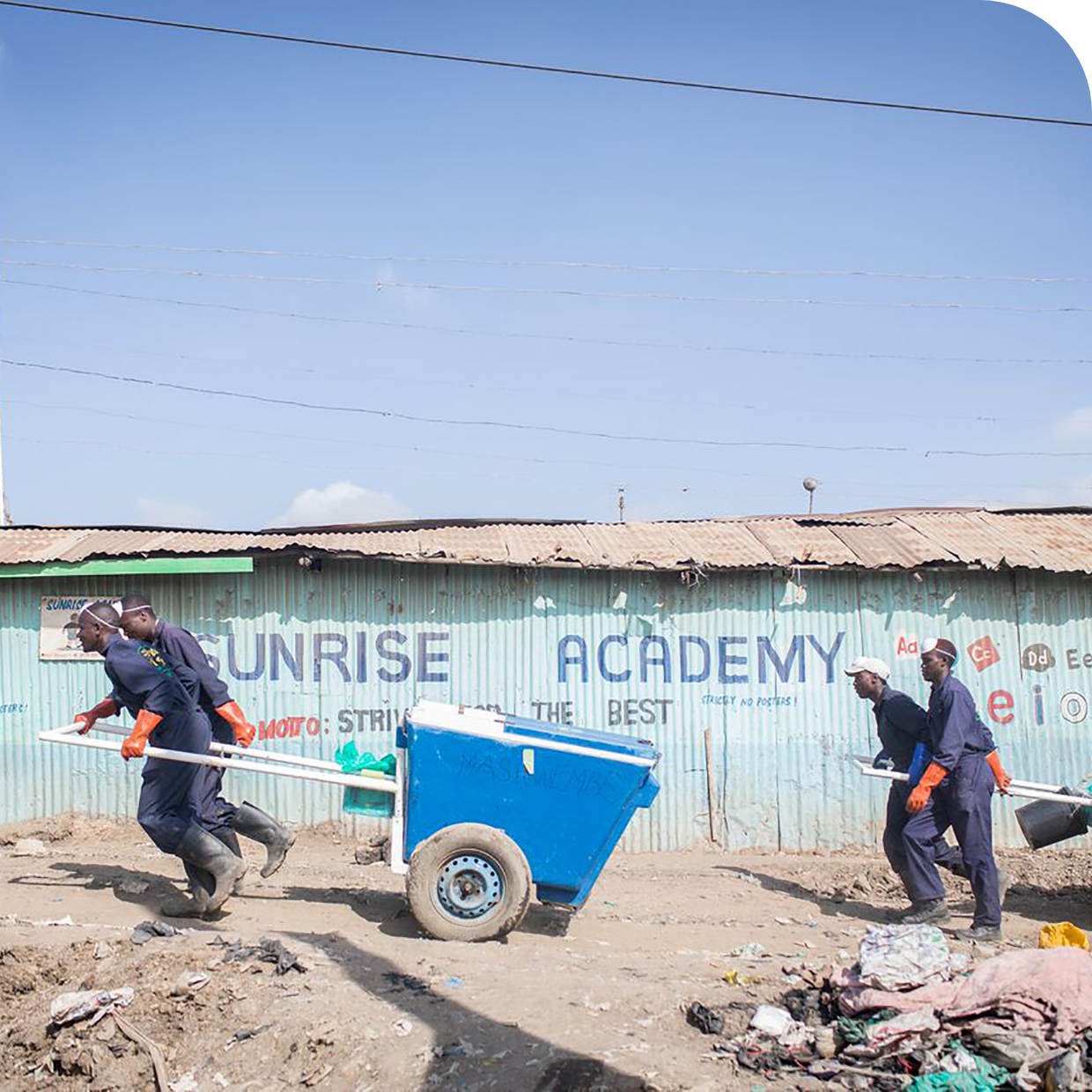 Fresh Life staff picking waste form the slums